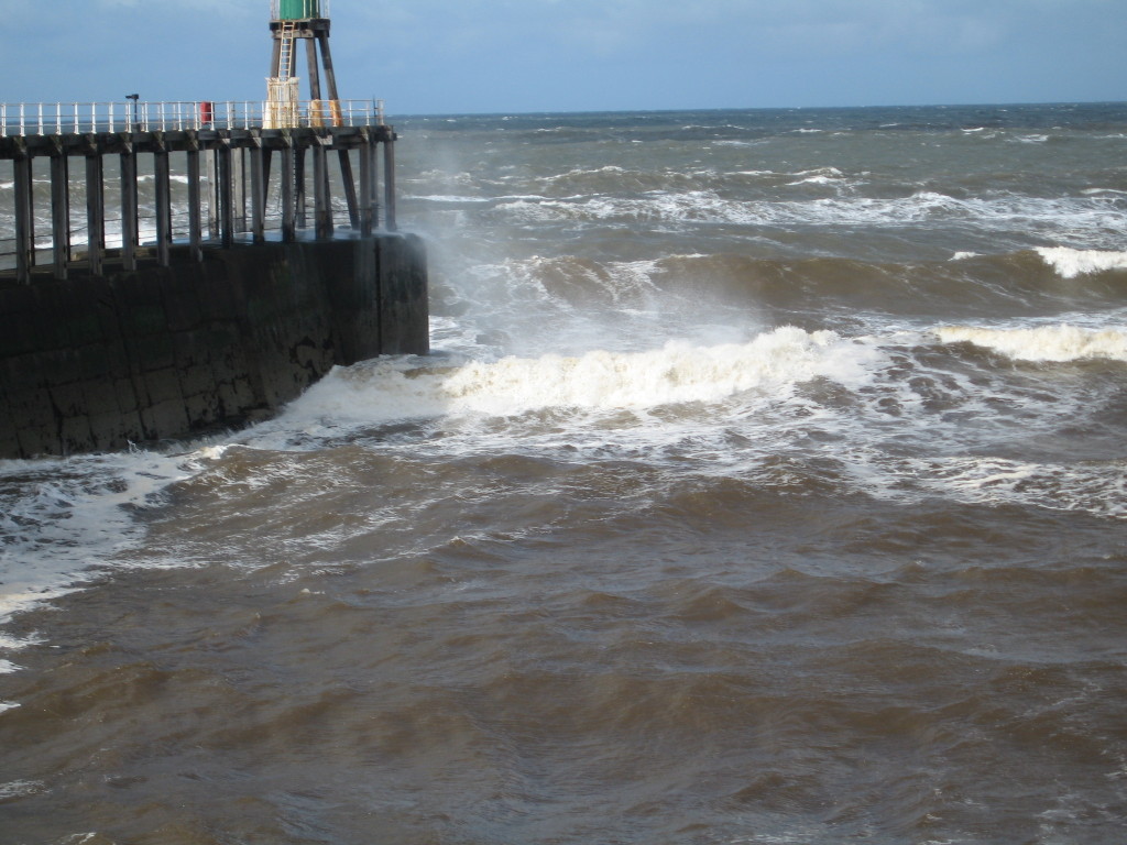 Waves crashing into the pier Photo credit: Cathy Hanson